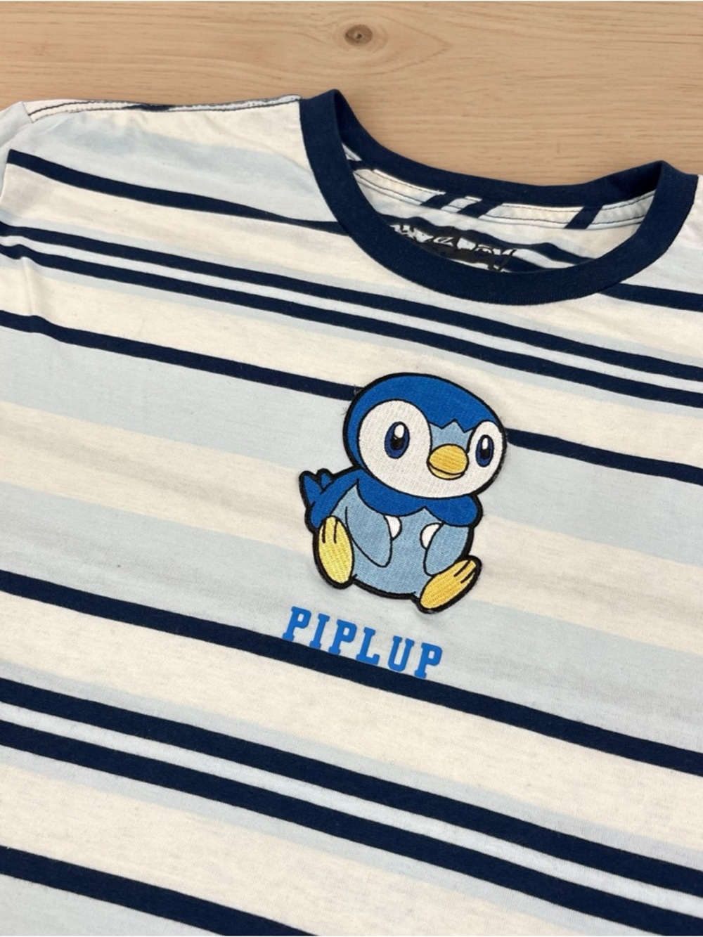 Pokemon Piplup Patch Striped Tee — White & Navy